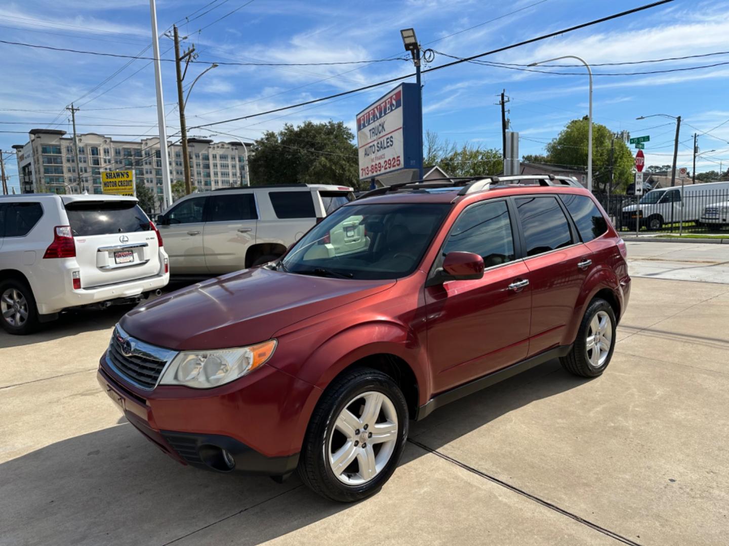 2009 Red /Black Subaru Forester X Limited (JF2SH64619H) with an 2.5 engine, Automatic transmission, located at 1501 West 15th St., Houston, 77008, (713) 869-2925, 29.797941, -95.411789 - Photo#0